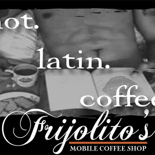 a shirtless man holding a book