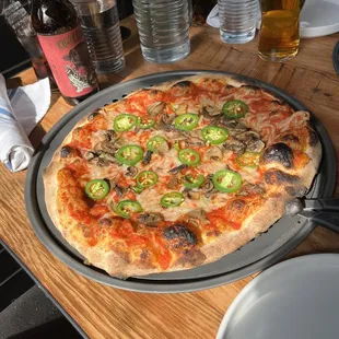 Margherita Pizza with jalapeños, mushrooms and vegan cheese