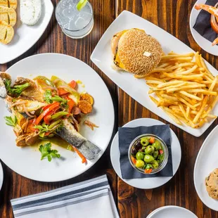 a variety of food on a wooden table