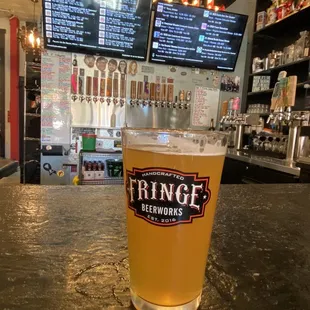 a pint of beer in a pint glass