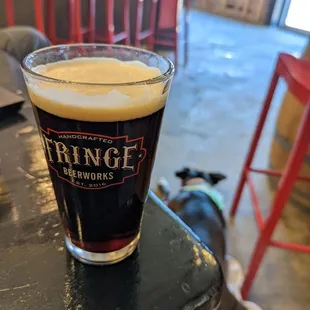 a glass of beer on a table