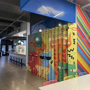 a brightly colored wall in a restaurant
