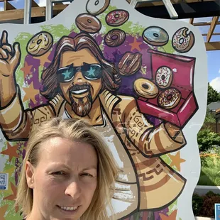 a woman standing in front of a sign