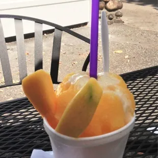 a bowl of fruit on a table