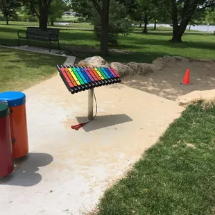 Drums, xylophone, and sand pit.