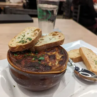 a bowl of soup and bread
