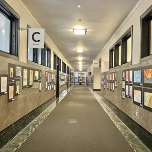 Artwork by local kids lines the hallway of the second floor