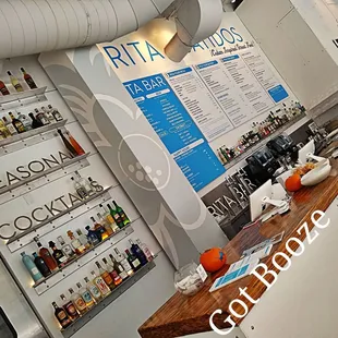 a bar with a menu on the wall