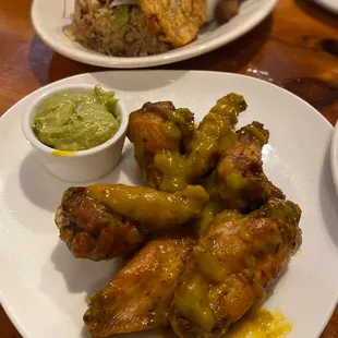 Spicy mango wings and avocado dip