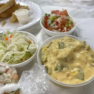 Zucchini stew (Guiso), cabbage slaw, salad, and fried yuca