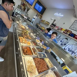 a man standing in front of a buffet