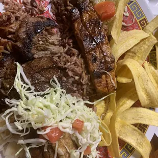 Combo plate Nicaraguan food at its finest. Tajadas, vigoron, ensalada, gallo pinto, carne asada maduro y queso frito.