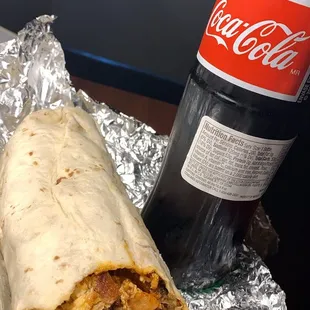 Bacon breakfast burrito with red Chile.