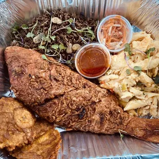 Snapper with djondjon rice and fried plantains.