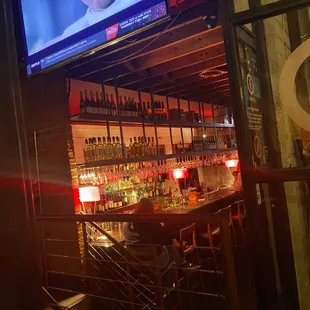 a bar with a large screen tv