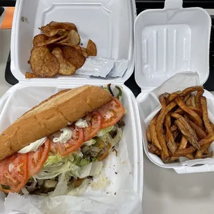 Steak hoagie, chips and fresh cut fries.