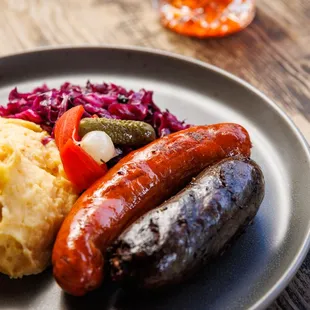 Lunch Iberian Bangers &amp; Mash - Linguica &amp; Merguez sausages, saffron mashed potatoes, braised red cabbage, mustard &amp; harissa.