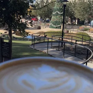 Vanilla Latte Patio seating overlooks a park with a Christmas tree!