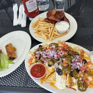 Nachos, spring rolls, and chicken tenders