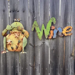 the word wine on a fence