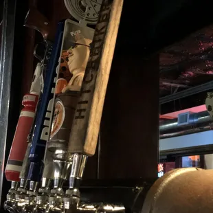 a row of beer taps