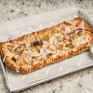 a pizza with onions and cheese