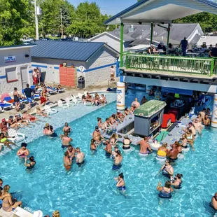 a crowd of people in a swimming pool