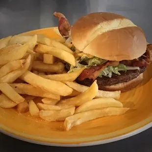 a burger and fries on a plate