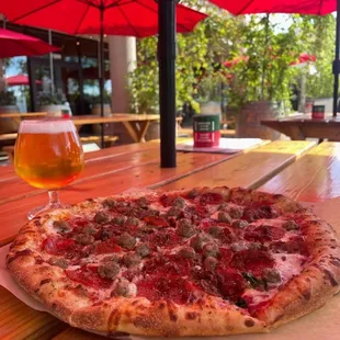 Pepperoni and sausage pizza with a nice cold beer