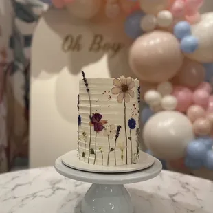 a white cake with flowers on it