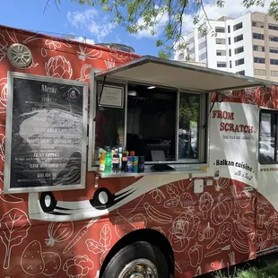a food truck parked in a park