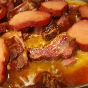 Sarma (sour cabbage leaves stuffed with ground beef, rice, carrots and cooked for hours in beef stock with smoked meat).