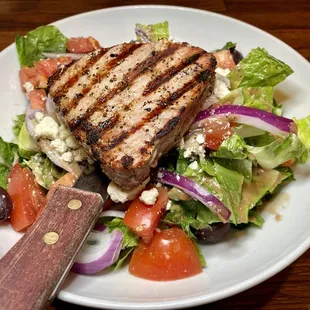 Fresh grilled tuna on a house salad.