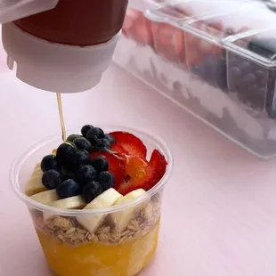 a bowl of fruit and yogurt