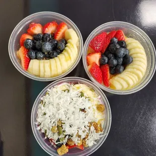 three bowls of fruit and nuts