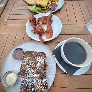 French toast, coffee, side note plate of bacon, smash burger
