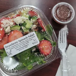 a salad in a plastic container