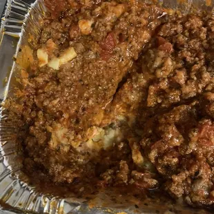 a tray of meat and potatoes