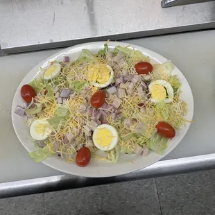 a plate of salad with hard boiled eggs