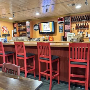 bar with red chairs