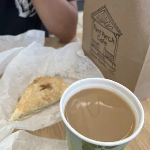 a cup of coffee and a pastry
