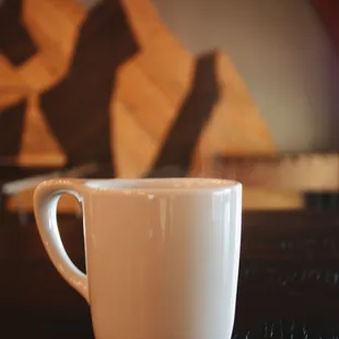 a coffee cup on a table