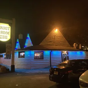 the front of the restaurant at night