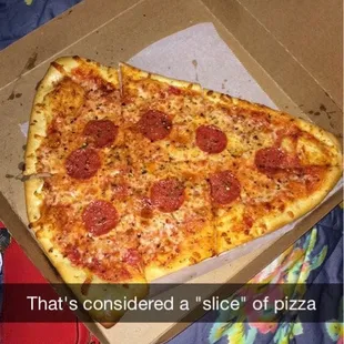 a slice of pizza in a box