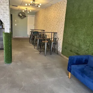 a living room with a blue couch