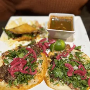 a plate of tacos on a table