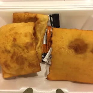 a close up of a sandwich in a styrofoam container