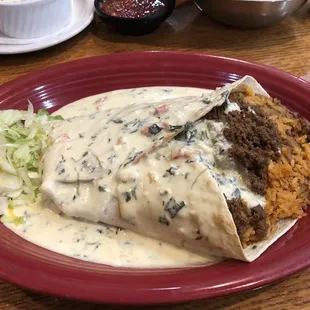 Chunky burrito with ground beef, rice and refried beans