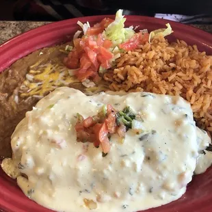 Chile relleno especial (the especial adds queso) with retried beans and Mexican rice