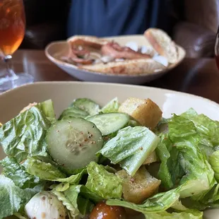 Starters.  Panzanella salad.  Pork belly and clams.